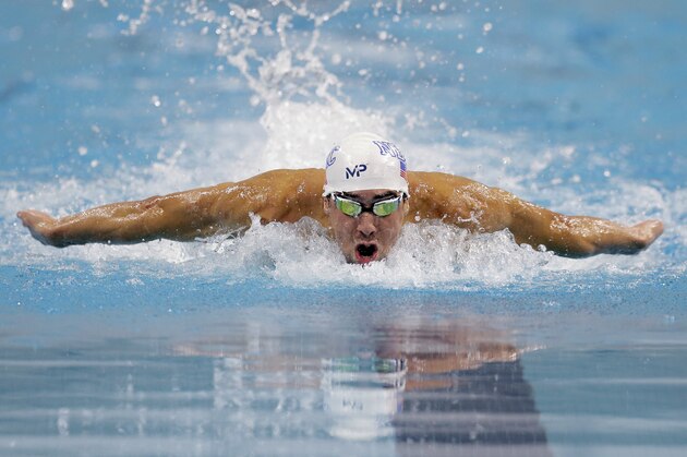 Michael Phelps competes in the finals of the men's 100-meter butterfly at the Longhorn Aquatics Elite Invite swimming event, Friday, June 3, 2016, in Austin, Texas. (AP Photo/Eric Gay) Michael Phelps competes in the finals of the men's 100-meter butterfly at the Longhorn Aquatics Elite Invite swimming event, Friday, June 3, 2016, in Austin, Texas. (AP Photo/Eric Gay)
