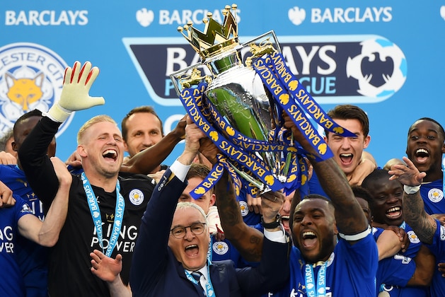 LEICESTER, ENGLAND - MAY 07:  Captain Wes Morgan and manager Claudio Ranieri of Leicester City lift the Premier League Trophy after the Barclays Premier League match between Leicester City and Everton at The King Power Stadium on May 7, 2016 in Leicester, United Kingdom.  (Photo by Laurence Griffiths/Getty Images)