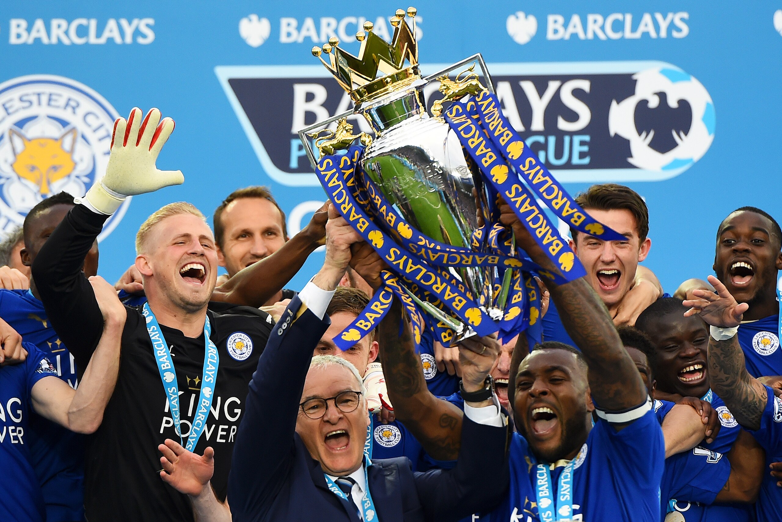 LEICESTER, ENGLAND - MAY 07:  Captain Wes Morgan and manager Claudio Ranieri of Leicester City lift the Premier League Trophy after the Barclays Premier League match between Leicester City and Everton at The King Power Stadium on May 7, 2016 in Leicester, United Kingdom.  (Photo by Laurence Griffiths/Getty Images)