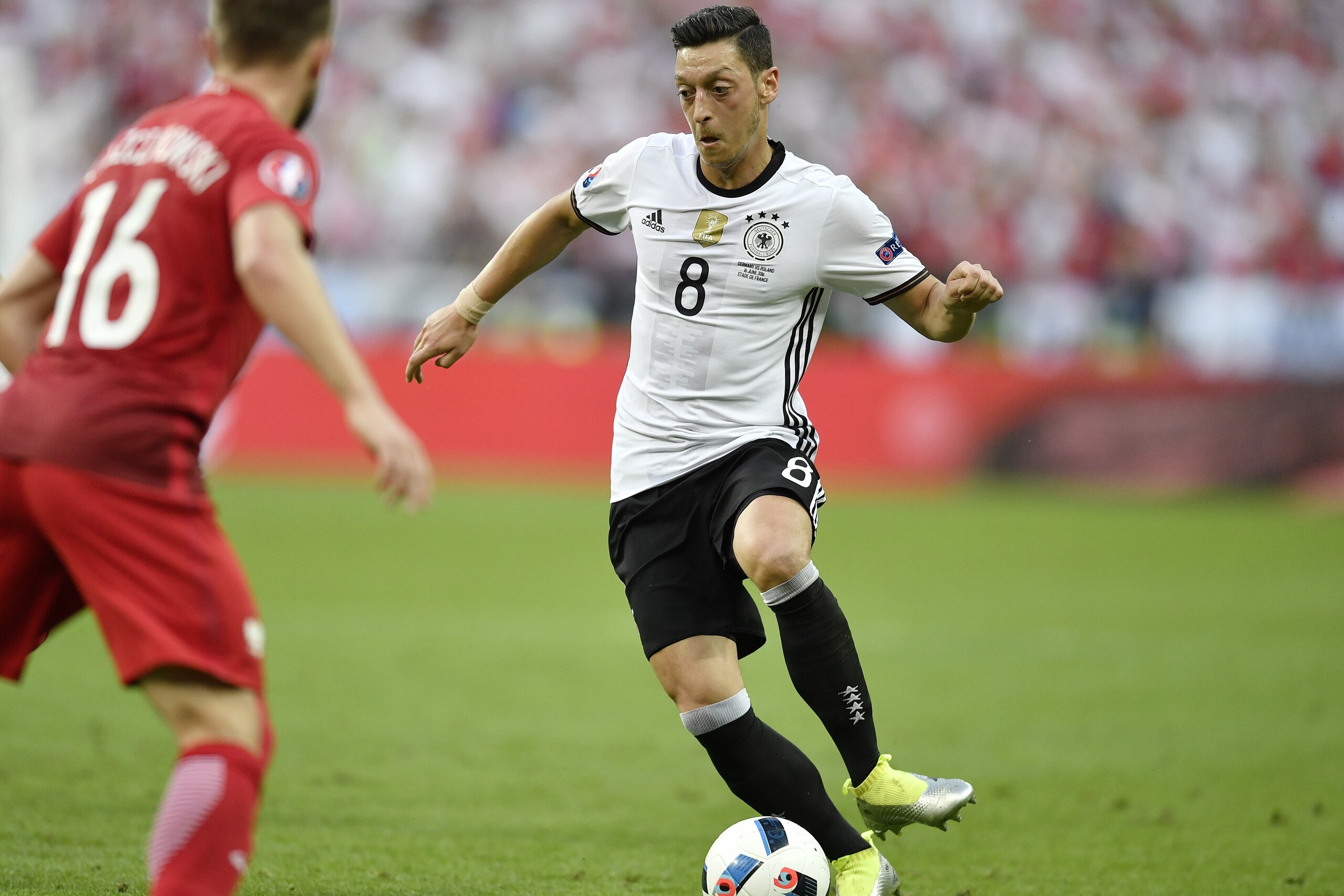 Germany’s Mesut Ozil plays the ball during the Euro 2016 Group C soccer match between Germany and Poland at the Stade de France in Saint-Denis, north of Paris, France, Thursday, June 16, 2016. (AP Photo/Martin Meissner) Germany’s Mesut Ozil plays the ball during the Euro 2016 Group C soccer match between Germany and Poland at the Stade de France in Saint-Denis, north of Paris, France, Thursday, June 16, 2016. (AP Photo/Martin Meissner)