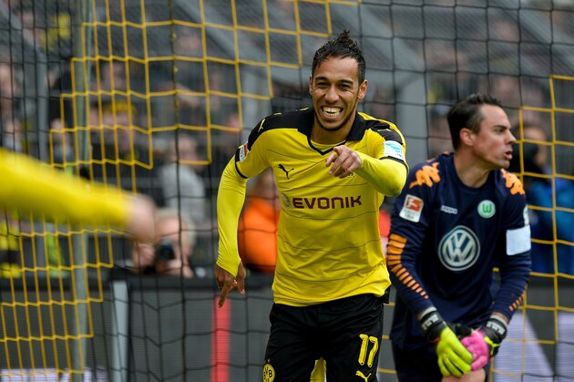 Dortmund's Gabonese striker Pierre-Emerick Aubameyang celebrates scoring the 4-0 goal during the German first division Bundesliga football match Borussia Dortmund vs VfL Wolfsburg, in Dortmund, western Germany, on April 30, 2016. / AFP / Sascha SCHï¿½ï¿½ï¿½ï¿½ï¿½ï¿½RMANN / RESTRICTIONS: DURING MATCH TIME: DFL RULES TO LIMIT THE ONLINE USAGE TO 15 PICTURES PER MATCH AND FORBID IMAGE SEQUENCES TO SIMULATE VIDEO. == RESTRICTED TO EDITORIAL USE == FOR FURTHER QUERIES PLEASE CONTACT DFL DIRECTLY AT + 49 69 650050
        (Photo credit should read SASCHA SCHURMANN/AFP/Getty Images)