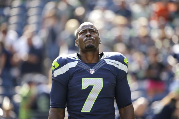 Seattle Seahawks quarterback Tarvaris Jackson stretches before an NFL football game against the Denver Broncos, Sunday, Sept. 21, 2014, in Seattle. (AP Photo/Elaine Thompson)