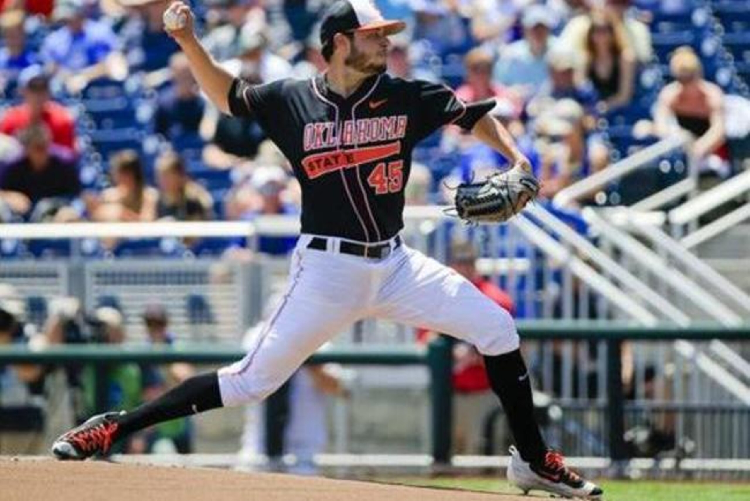 Oklahoma State starting pitcher Thomas Hatch (45) works against UC Santa Barbara in the first inning of an NCAA men's College World Series baseball game in Omaha, Neb., Saturday, June 18, 2016. (AP Photo/Nati Harnik)