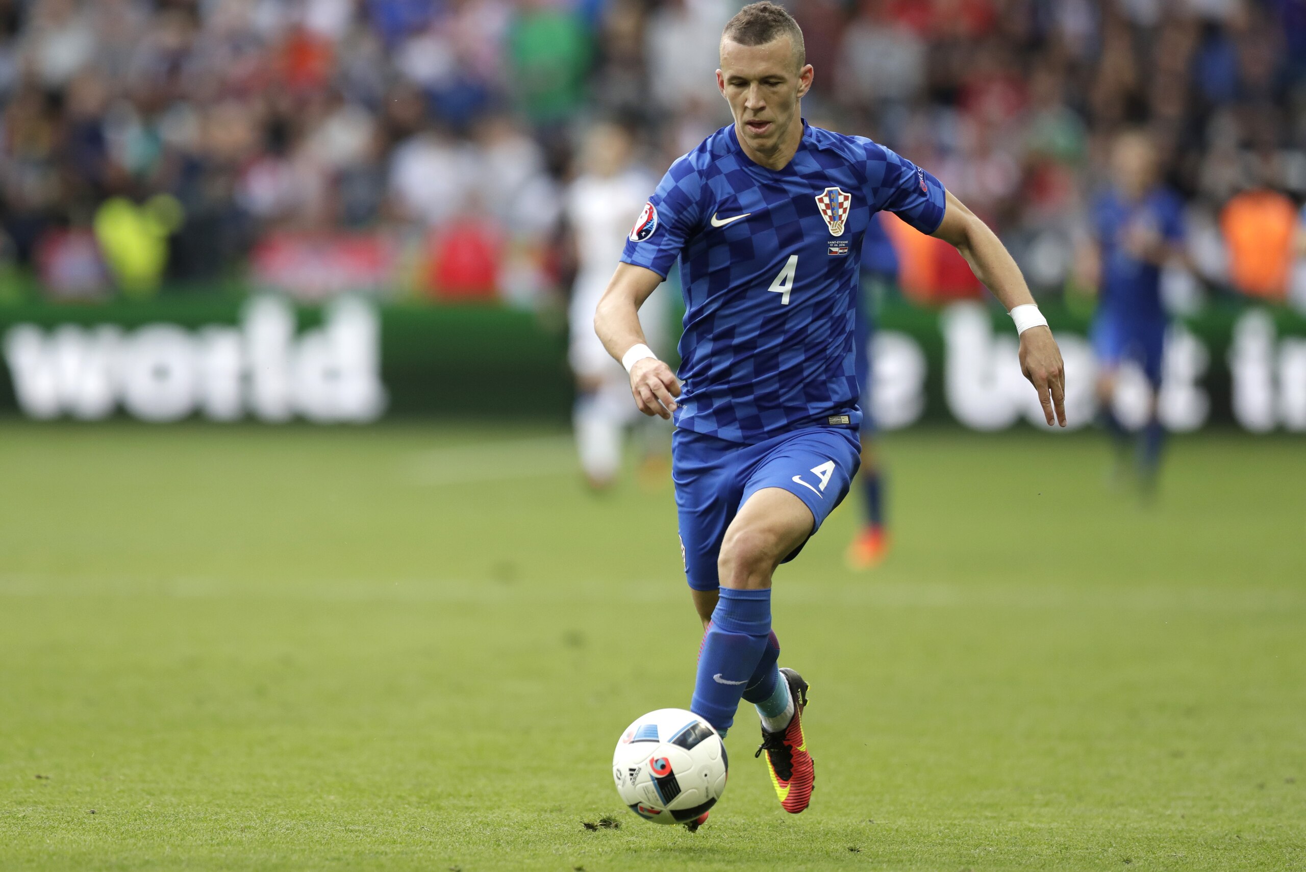 Croatia's Ivan Perisic  runs with the ball during the Euro 2016 Group D soccer match between the Czech Republic and Croatia at the Geoffroy Guichard stadium in Saint-Etienne, France, Friday, June 17, 2016. (AP Photo/Pavel Golovkin)