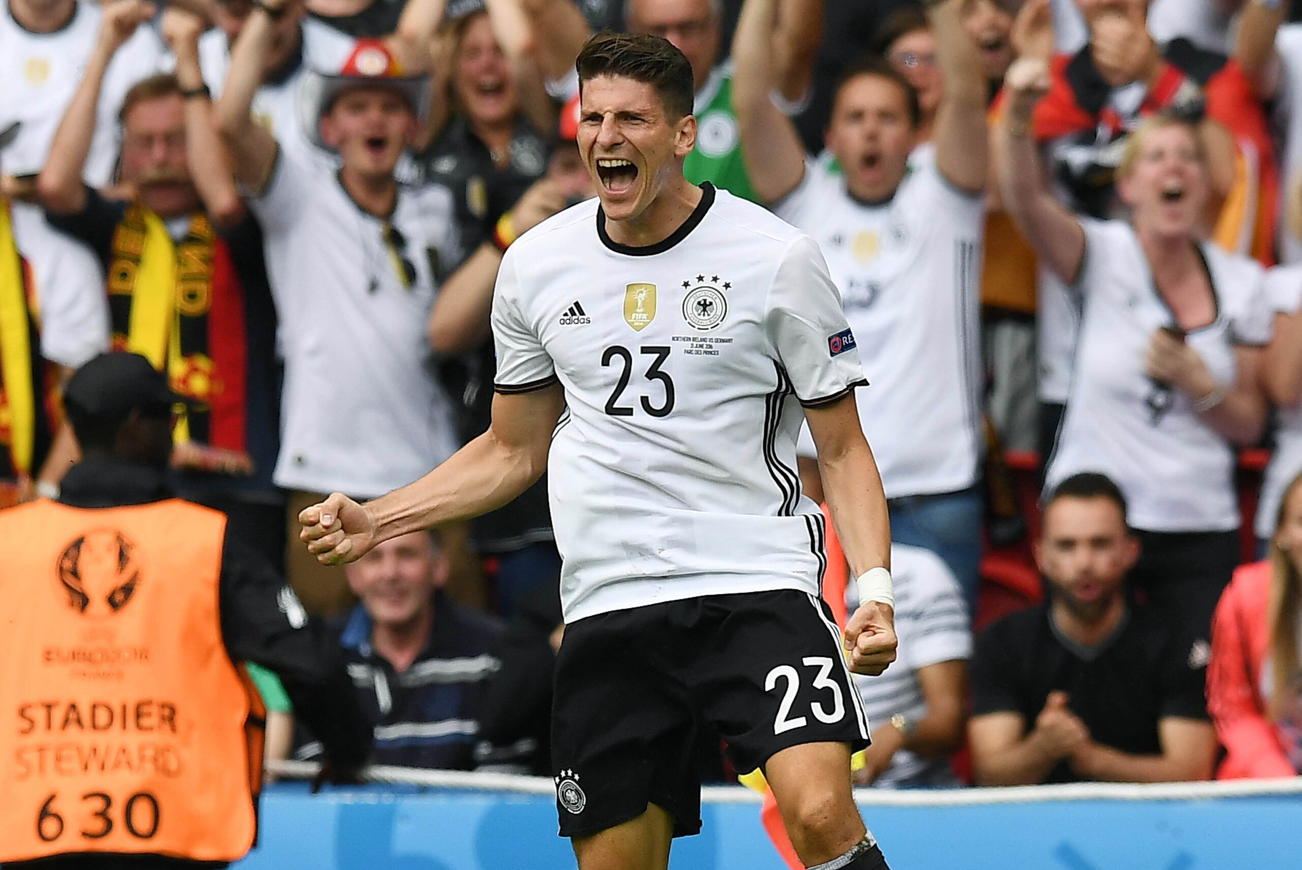 PARIS, FRANCE - JUNE 21: Mario Gomez of Germany celebrates after scoring during the UEFA EURO 2016 Group C match between Northern Ireland and Germany at Parc des Princes on June 21, 2016 in Paris, France. (Photo by Charles McQuillan/Getty Images)