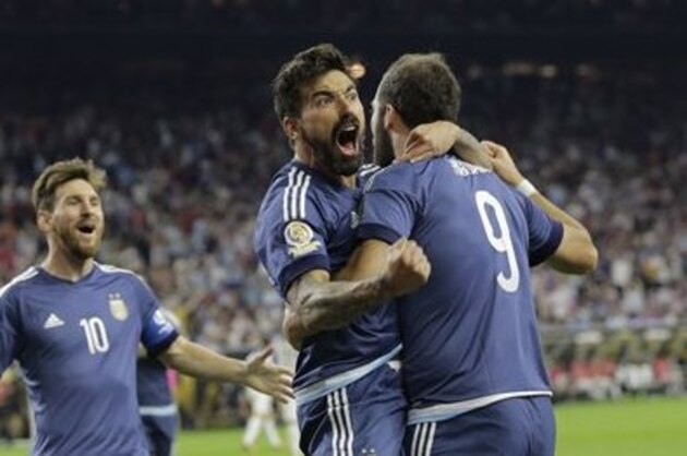 Argentina forward Gonzalo Higuain (9) celebrates his goal against the United States with midfielder Lionel Messi, left, and  forward Ezequiel Lavezzi, center, during a Copa America Centenario semifinal soccer match, Tuesday, June 21, 2016, in Houston. Argentina won 4-0. (AP Photo/Eric Gay)