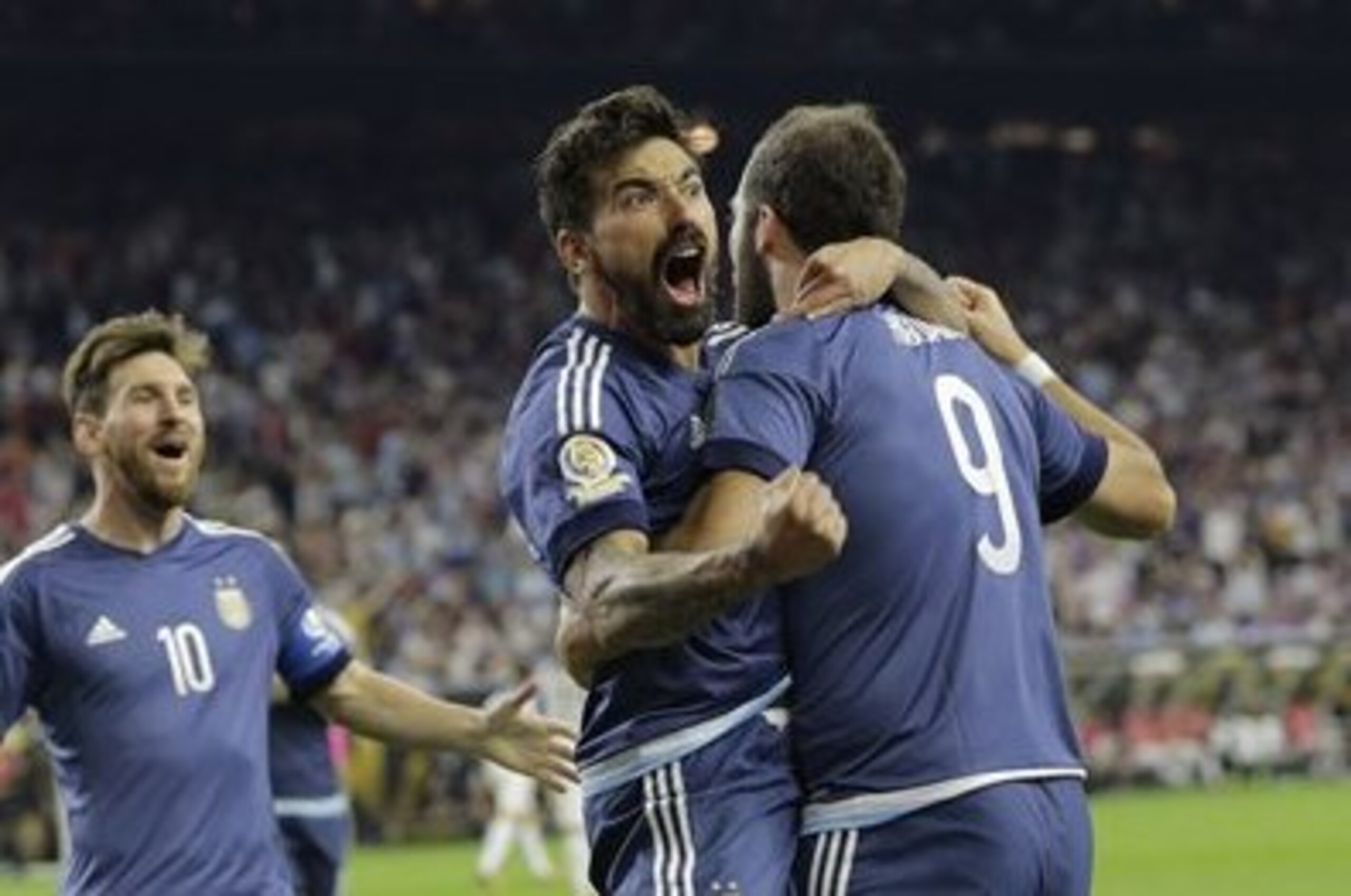 Argentina forward Gonzalo Higuain (9) celebrates his goal against the United States with midfielder Lionel Messi, left, and forward Ezequiel Lavezzi, center, during a Copa America Centenario semifinal soccer match, Tuesday, June 21, 2016, in Houston. Argentina won 4-0. (AP Photo/Eric Gay) Argentina forward Gonzalo Higuain (9) celebrates his goal against the United States with midfielder Lionel Messi, left, and forward Ezequiel Lavezzi, center, during a Copa America Centenario semifinal soccer match, Tuesday, June 21, 2016, in Houston. Argentina won 4-0. (AP Photo/Eric Gay)