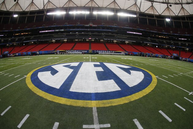 The SEC logo is seen Friday, Dec. 5, 2014, in Atlanta, ahead of the Southeastern Conference championship football game between Alabama and Missouri held Saturday. (AP Photo/John Bazemore)