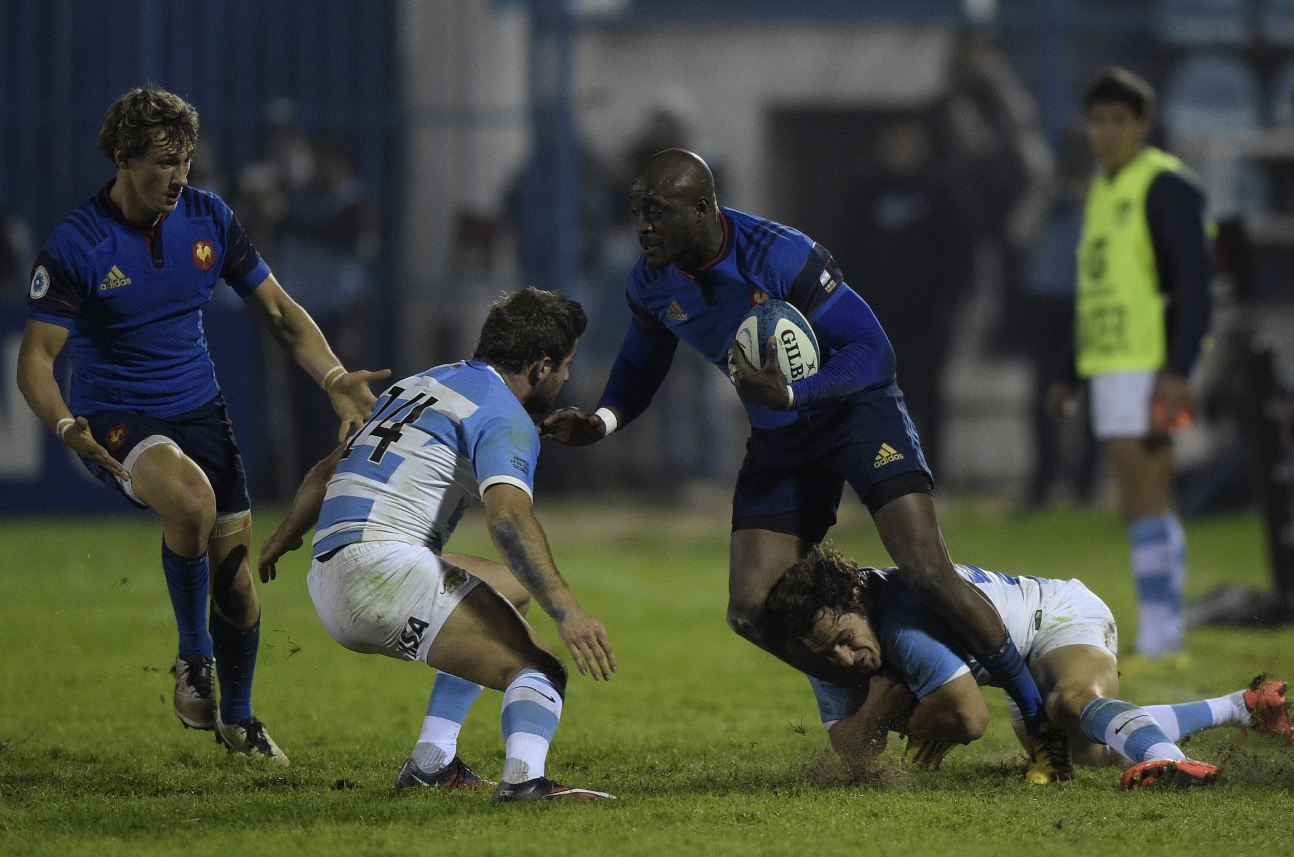 France's wing Djibril Camara (2-R) is tackled by Argentina's Los Pumas fly half Nicolas Sanchez (R) and wing Santiago Cordero (C) during their Rugby Union test match at the Jose Fierro stadium in Tucuman, Argentina, on June 19, 2016. Argentina won 30-19. / AFP / JUAN MABROMATA (Photo credit should read JUAN MABROMATA/AFP/Getty Images) France's wing Djibril Camara (2-R) is tackled by Argentina's Los Pumas fly half Nicolas Sanchez (R) and wing Santiago Cordero (C) during their Rugby Union test match at the Jose Fierro stadium in Tucuman, Argentina, on June 19, 2016. Argentina won 30-19. / AFP / JUAN MABROMATA (Photo credit should read JUAN MABROMATA/AFP/Getty Images)