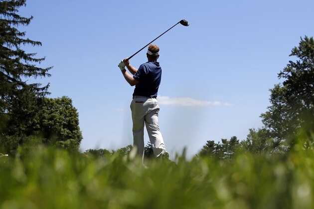 Billy Hurley III watches his shot from the third tee during the third round of the Quicken Loans National PGA golf tournament, Saturday, June 25, 2016, in Bethesda, Md. (AP Photo/Patrick Semansky)