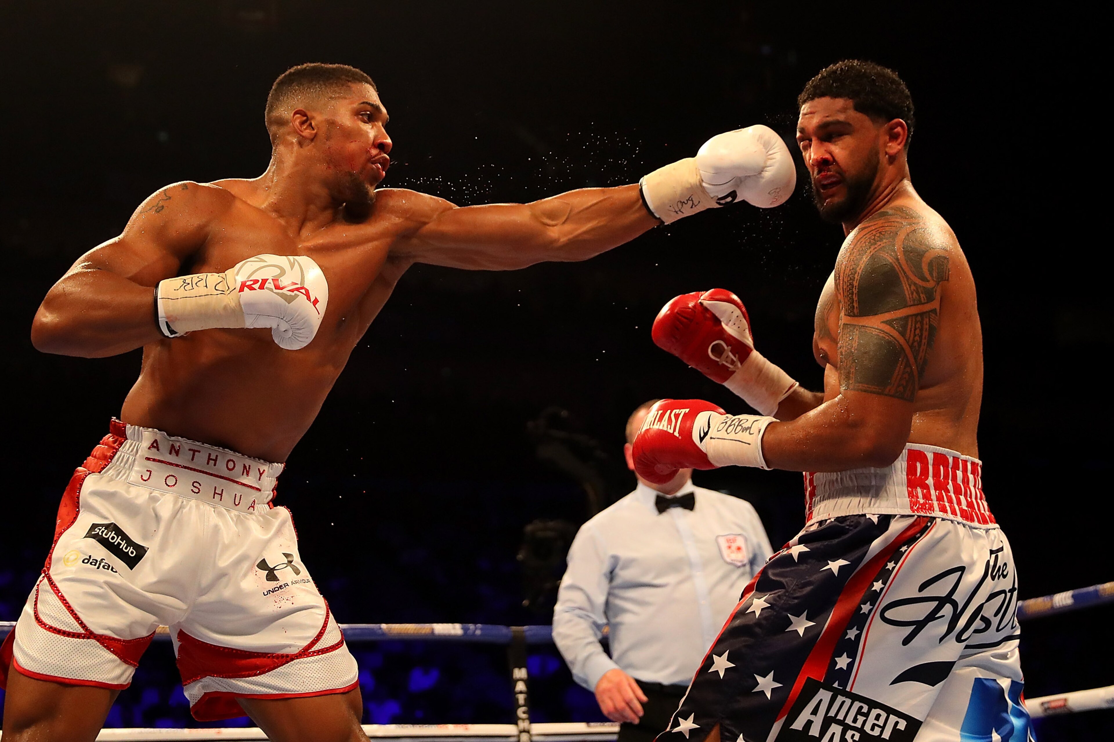 LONDON, ENGLAND - JUNE 25:  Anthony Joshua of Great Britain lands a punch on Dominic Breazeale of The USA during their IBF World Heavyweight Championship bout at The O2 Arena on June 25, 2016 in London, England.  (Photo by Richard Heathcote/Getty Images)