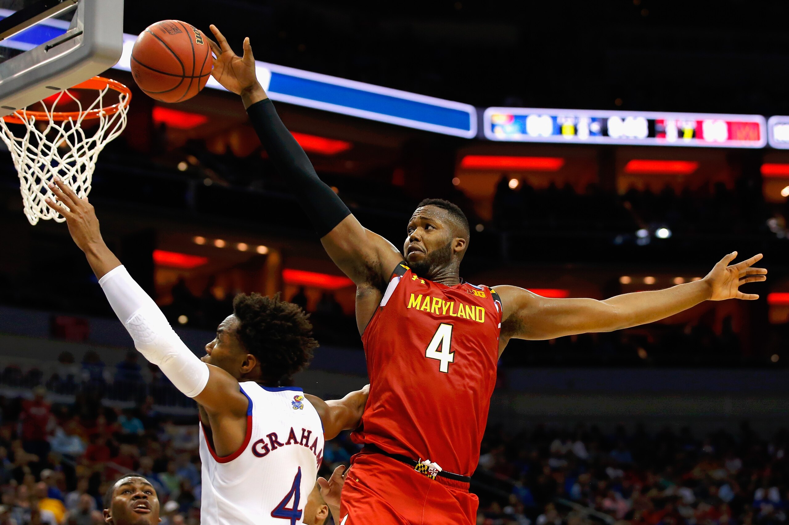 LOUISVILLE, KY - MARCH 24:  Robert Carter #4 of the Maryland Terrapins defends a shot by Devonte' Graham #4 of the Kansas Jayhawks in the second half during the 2016 NCAA Men's Basketball Tournament South Regional at KFC YUM! Center on March 24, 2016 in Louisville, Kentucky.  (Photo by Kevin C. Cox/Getty Images)