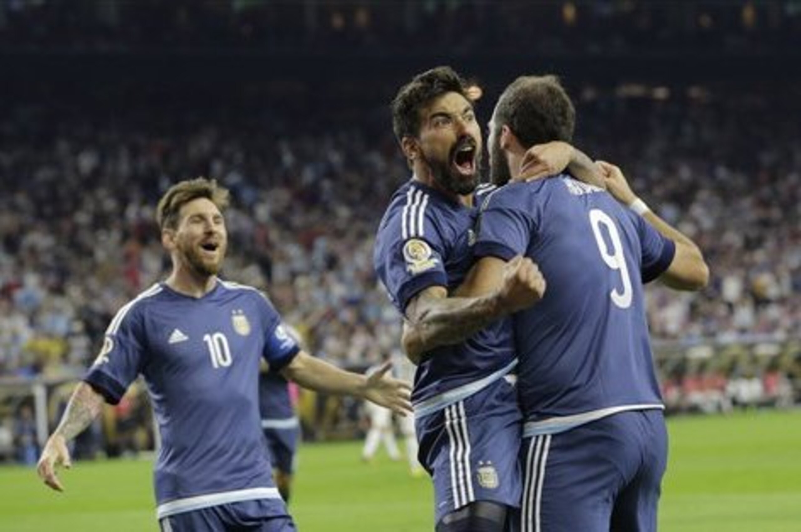 Argentina forward Gonzalo Higuain (9) celebrates his goal against the United States with midfielder Lionel Messi, left, and forward Ezequiel Lavezzi, center, during a Copa America Centenario semifinal soccer match, Tuesday, June 21, 2016, in Houston. Argentina won 4-0. (AP Photo/Eric Gay) Argentina forward Gonzalo Higuain (9) celebrates his goal against the United States with midfielder Lionel Messi, left, and forward Ezequiel Lavezzi, center, during a Copa America Centenario semifinal soccer match, Tuesday, June 21, 2016, in Houston. Argentina won 4-0. (AP Photo/Eric Gay)
