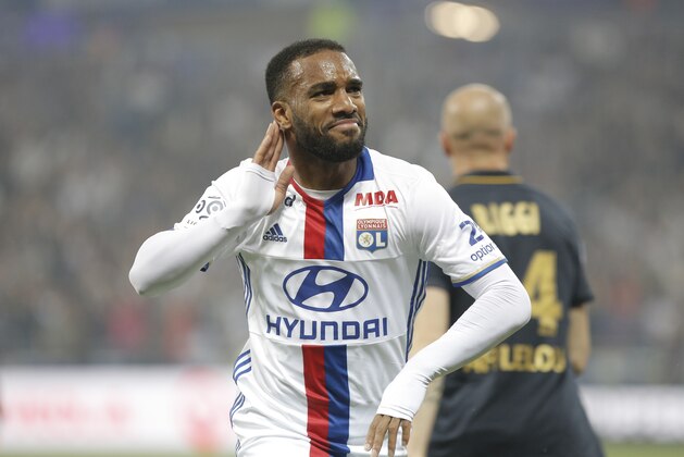 Lyon's Alexandre Lacazette celebrates after he scored a goal against Monaco during their French League One soccer match in Decines, near Lyon, central France, Saturday, May 7, 2016. (AP Photo/Laurent Cipriani)