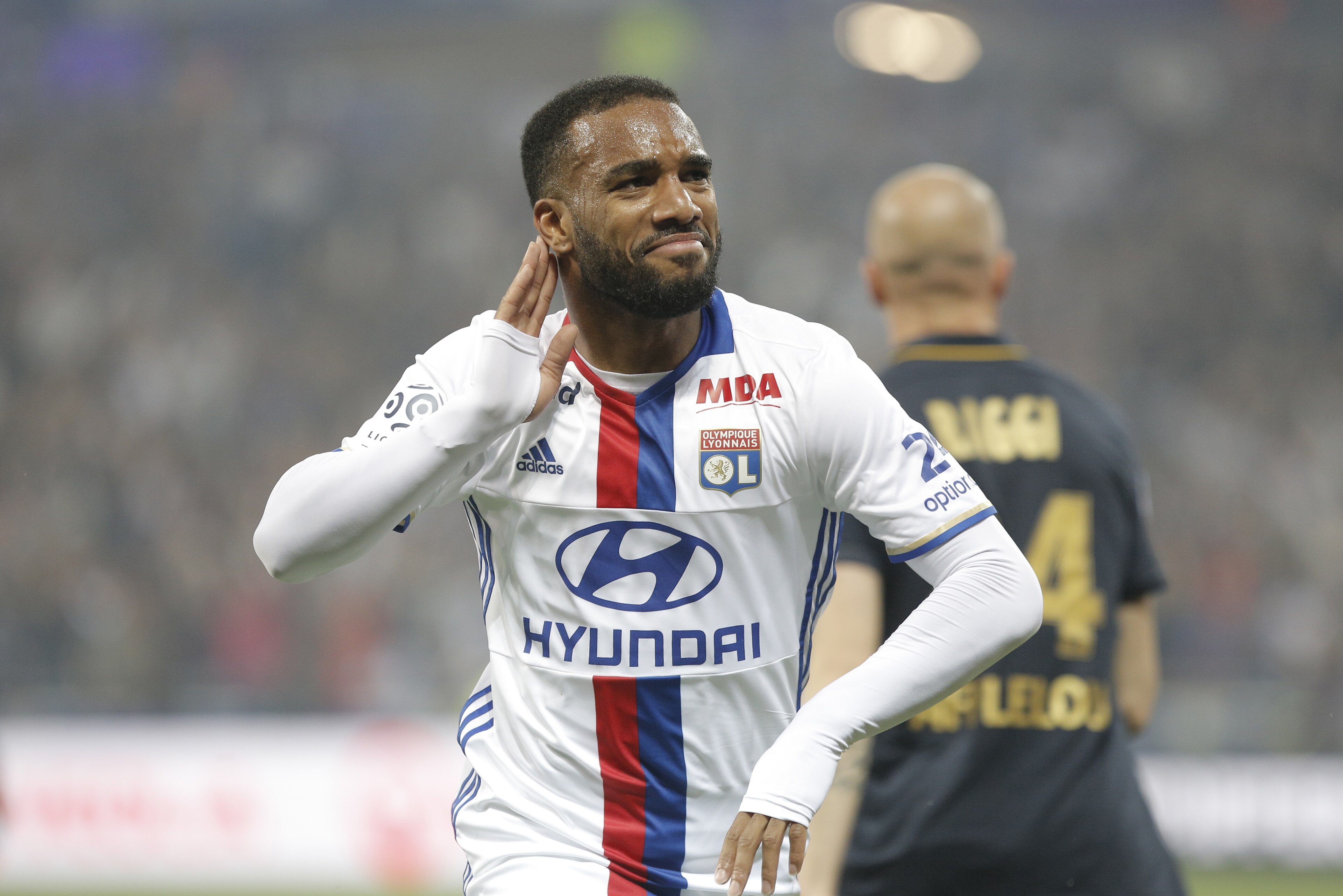 Lyon's Alexandre Lacazette celebrates after he scored a goal against Monaco during their French League One soccer match in Decines, near Lyon, central France, Saturday, May 7, 2016. (AP Photo/Laurent Cipriani)