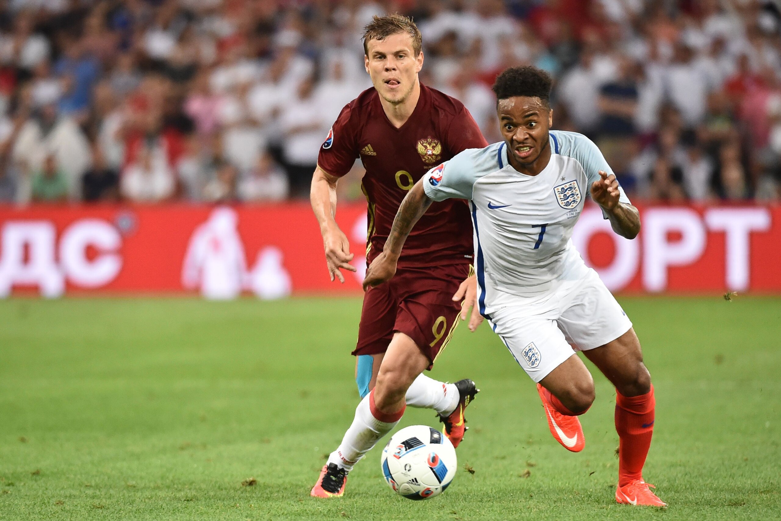 England's midfielder Raheem Sterling (R) dribbles past Russia's forward Alexander Kokorin during the Euro 2016 group B football match between England and Russia at the Stade Velodrome in Marseille on June 11, 2016. / AFP / BERTRAND LANGLOIS (Photo credit should read BERTRAND LANGLOIS/AFP/Getty Images) England's midfielder Raheem Sterling (R) dribbles past Russia's forward Alexander Kokorin during the Euro 2016 group B football match between England and Russia at the Stade Velodrome in Marseille on June 11, 2016. / AFP / BERTRAND LANGLOIS (Photo credit should read BERTRAND LANGLOIS/AFP/Getty Images)
