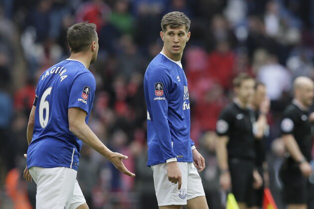 Everton’s John Stones, right, talks to Everton’s Phil Jagielka during the English FA Cup semifinal between Manchester United and Everton at Wembley in London, Saturday, April 23,  2016. (AP Photo/Tim Ireland)