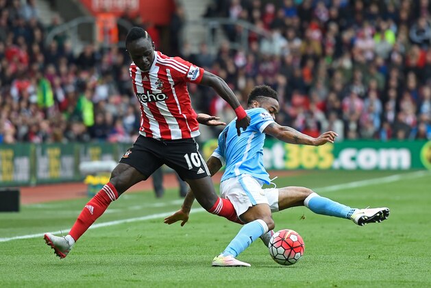 SOUTHAMPTON, ENGLAND - MAY 01: Sadio Mane of Southampton challenges Raheem Sterling of Manchester City during the Barclays Premier League match between Southampton and Manchester City at St Mary's Stadium on May 1, 2016 in Southampton, England.  (Photo by Mike Hewitt/Getty Images)