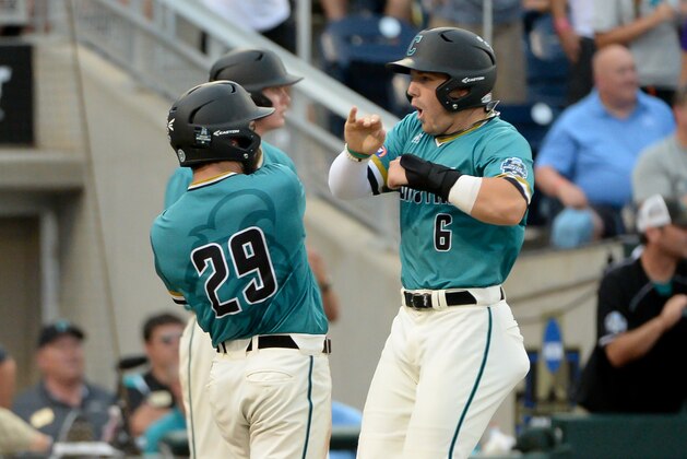 Jun 25, 2016; Omaha, NE, USA; Coastal Carolina Chanticleers infielder Connor Owings (6) celebrates with outfielder Anthony Marks (29) after scoring against the TCU Horned Frogs in the third inning in the 2016 College World Series at TD Ameritrade Park. Mandatory Credit: Steven Branscombe-USA TODAY Sports