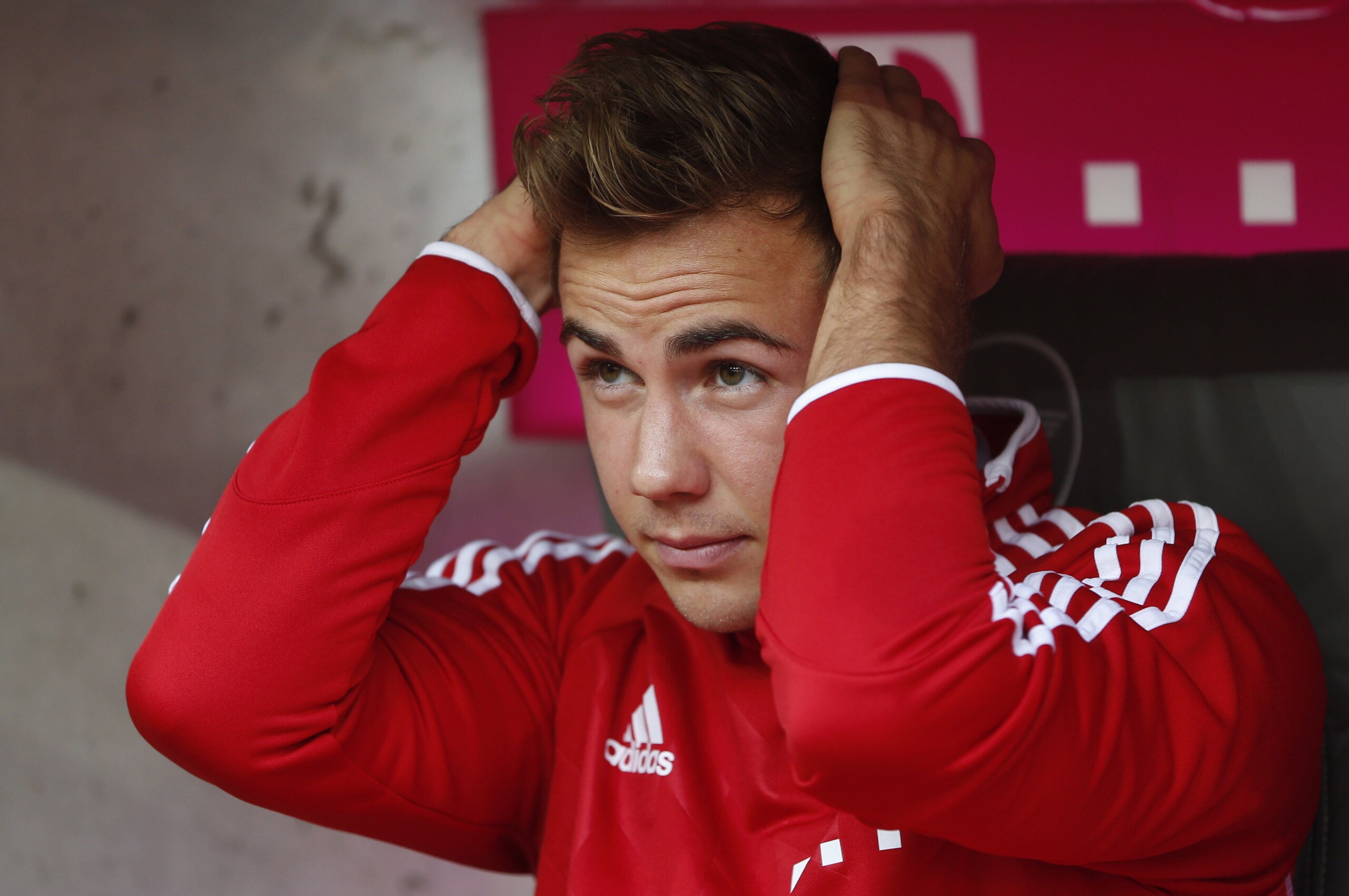 Bayern's Mario Goetze sits on the bench prior to the German first division Bundesliga soccer match between FC Bayern Munich and Hertha BSC Berlin, in Munich, southern Germany, Saturday, Oct. 26, 2013. (AP Photo/Matthias Schrader)