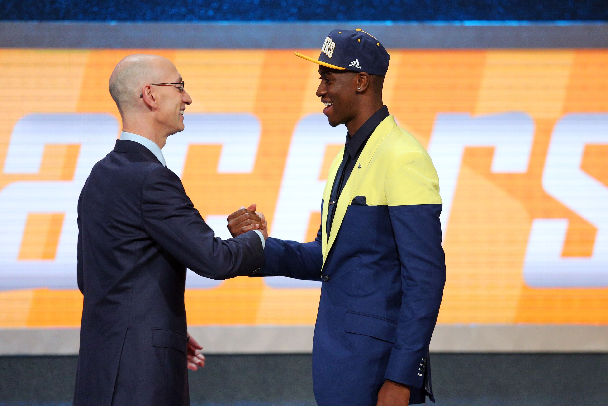 Jun 23, 2016; New York, NY, USA; Caris Levert (Michigan) greets NBA commissioner Adam Silver after being selected as the number twenty overall pick to the Indiana Pacers in the first round of the 2016 NBA Draft at Barclays Center. Mandatory Credit: Brad Penner-USA TODAY Sports