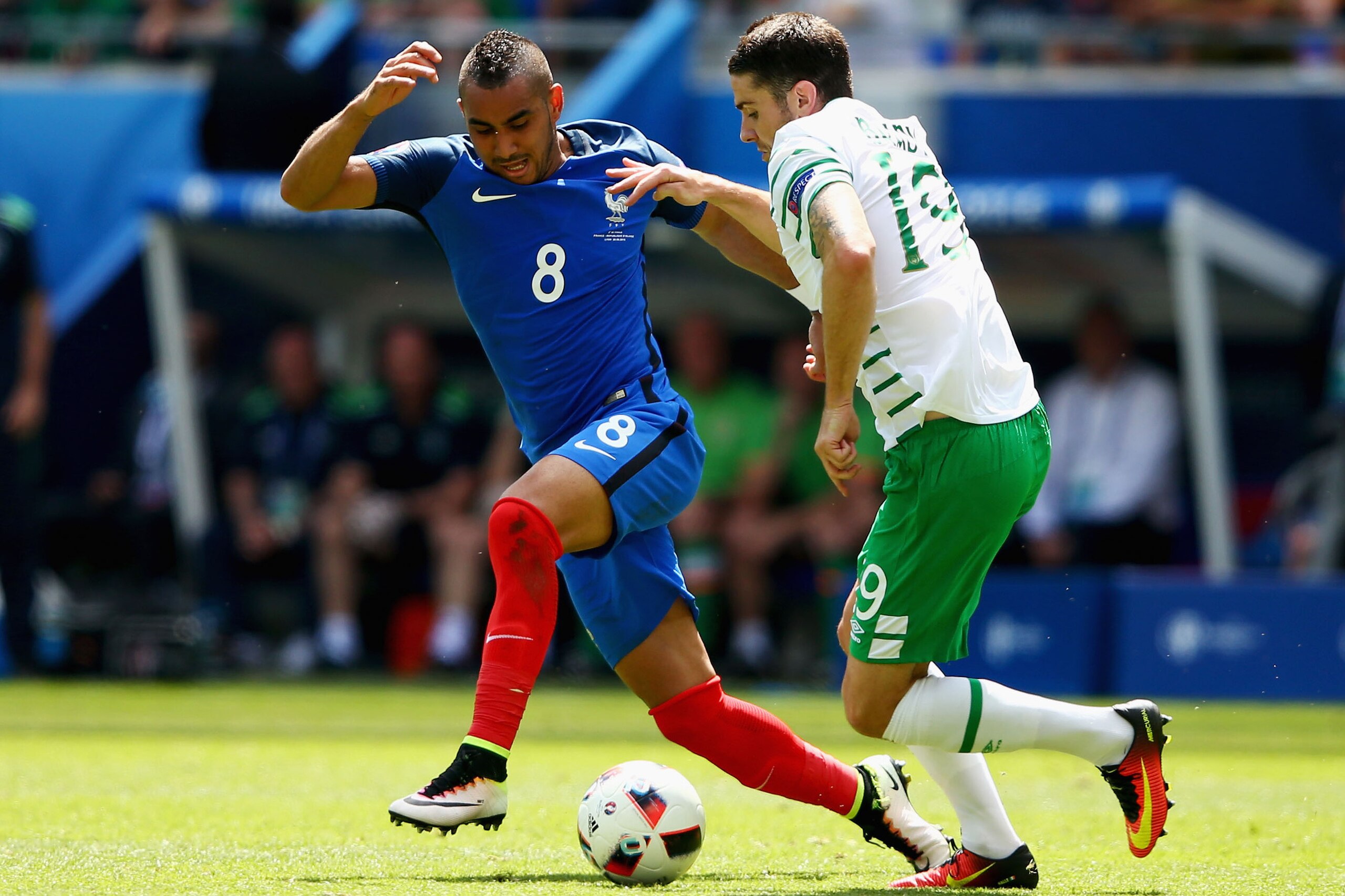 LYON, FRANCE - JUNE 26: Dimitri Payet of France and Robbie Brady of Republic of Ireland compete for the ball during the UEFA EURO 2016 round of 16 match between France and Republic of Ireland at Stade des Lumieres on June 26, 2016 in Lyon, France.  (Photo by Alex Livesey/Getty Images)