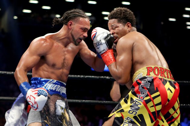 Keith Thurman, left, lands an uppercut against Shawn Porter during their WBA Welterweight title fight at the Barclays Center in Brooklyn borough of New York on Saturday, June 25, 2016. Thurman won via unanimous decision to retain his title. (AP Photo/Gregory Payan) Keith Thurman, left, lands an uppercut against Shawn Porter during their WBA Welterweight title fight at the Barclays Center in Brooklyn borough of New York on Saturday, June 25, 2016. Thurman won via unanimous decision to retain his title. (AP Photo/Gregory Payan)