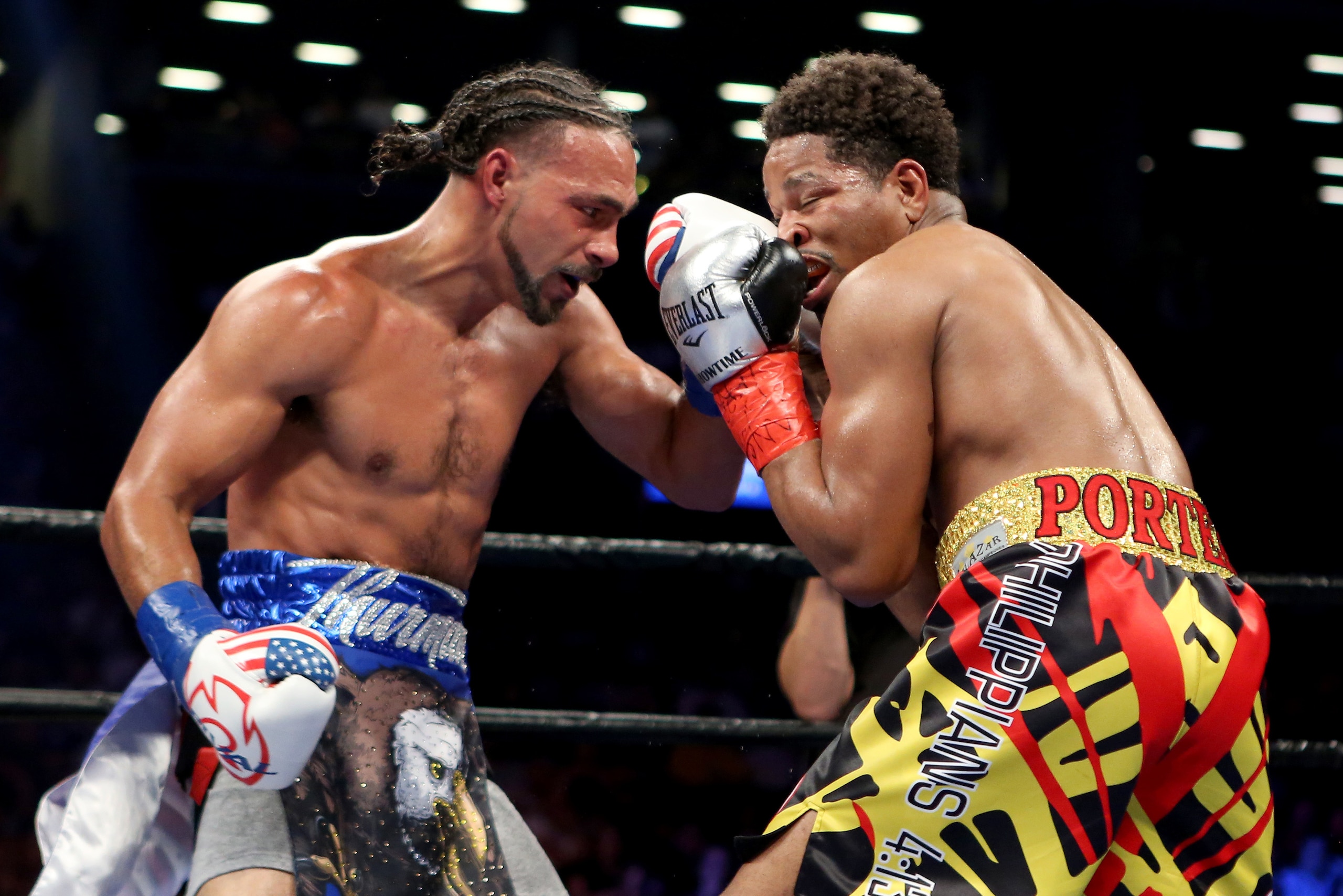 Keith Thurman, left, lands an uppercut against Shawn Porter during their WBA Welterweight title fight at the Barclays Center in Brooklyn borough of New York on Saturday, June 25, 2016. Thurman won via unanimous decision to retain his title. (AP Photo/Gregory Payan)