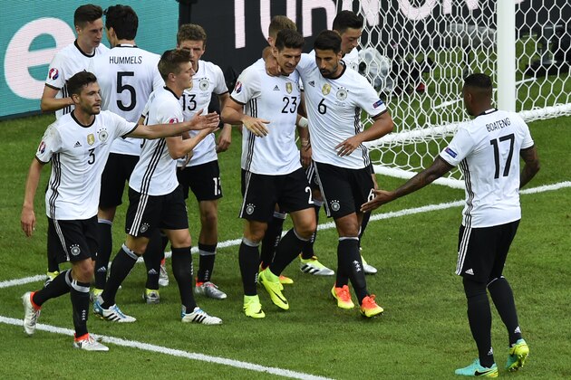 Germany's forward Mario Gomez (C) celebrates with teammates after scoring during the Euro 2016 round of 16 football match between Germany and Slovakia at the Pierre-Mauroy stadium in Villeneuve-d'Ascq, near Lille, on June 26, 2016.   / AFP / DENIS CHARLET        (Photo credit should read DENIS CHARLET/AFP/Getty Images)