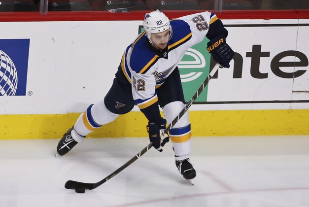 St. Louis Blues defenseman Kevin Shattenkirk (22) looks to pass the puck against the Chicago Blackhawks during the first period of an NHL hockey game Thursday, April 7, 2016, in Chicago. (AP Photo/Kamil Krzaczynski)