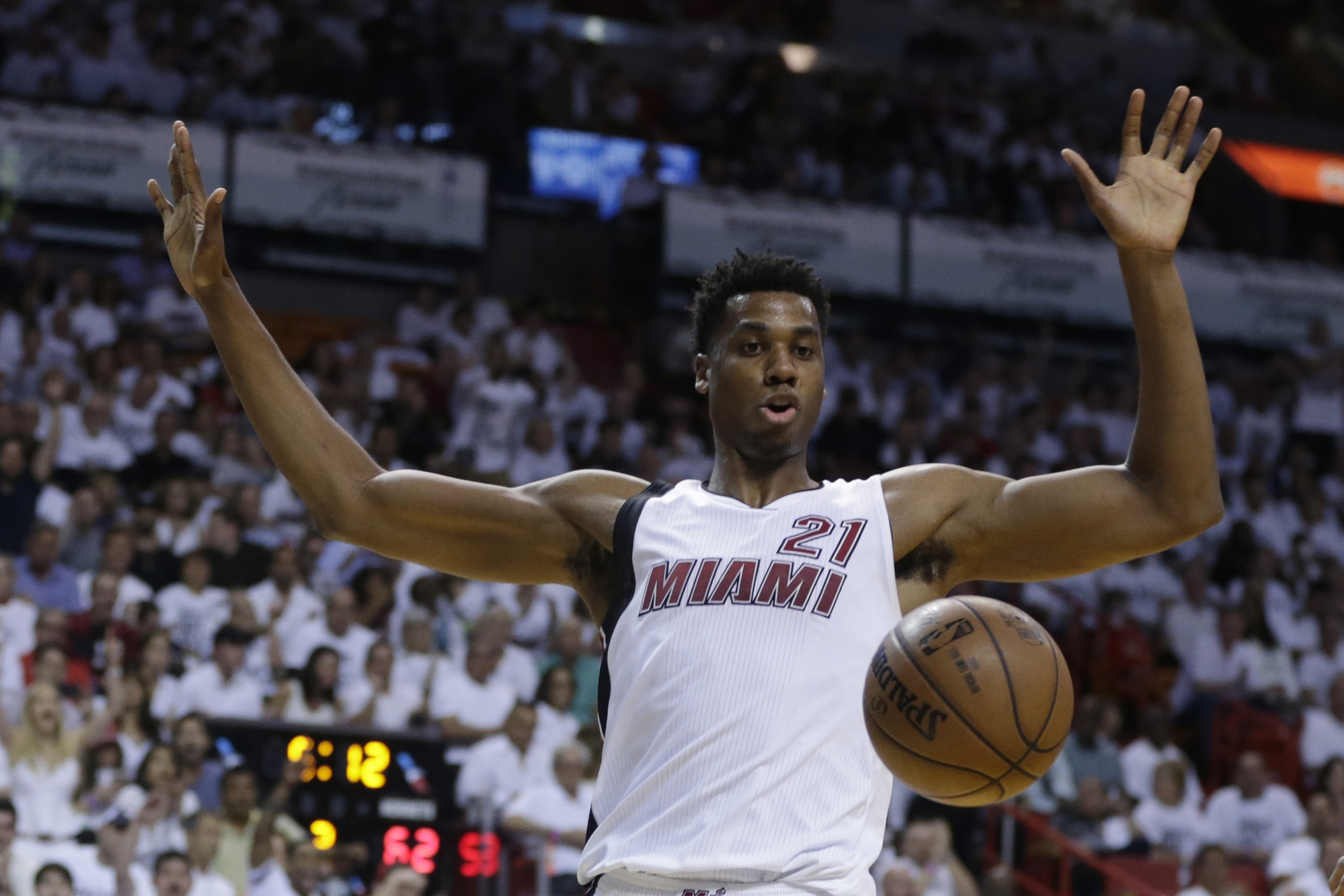 Miami Heat center Hassan Whiteside (21) reacts after dunking the ball during the second half of Game 1 of a first-round NBA basketball playoff series against the Charlotte Hornets, Sunday, April 17, 2016, in Miami. The Heat defeated the Hornets 123-91. (AP Photo/Lynne Sladky)