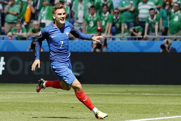 France's Antoine Griezmann celebrates after scoring his side's second goal during the Euro 2016 round of 16 soccer match between France and Ireland, at the Grand Stade in Decines-­Charpieu, near Lyon, France, Sunday, June 26, 2016. (AP Photo/Laurent Cipriani)