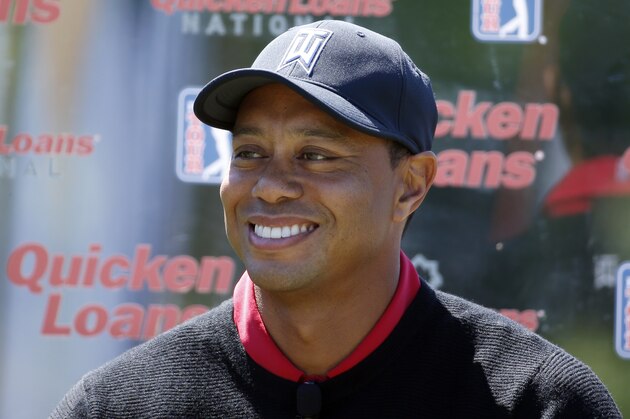 Tiger Woods pauses during a Quicken Loans National golf tournament media availability on the 10th tee at Congressional Country Club, Monday, May 16, 2016 in Bethesda, Md. (AP Photo/Alex Brandon)