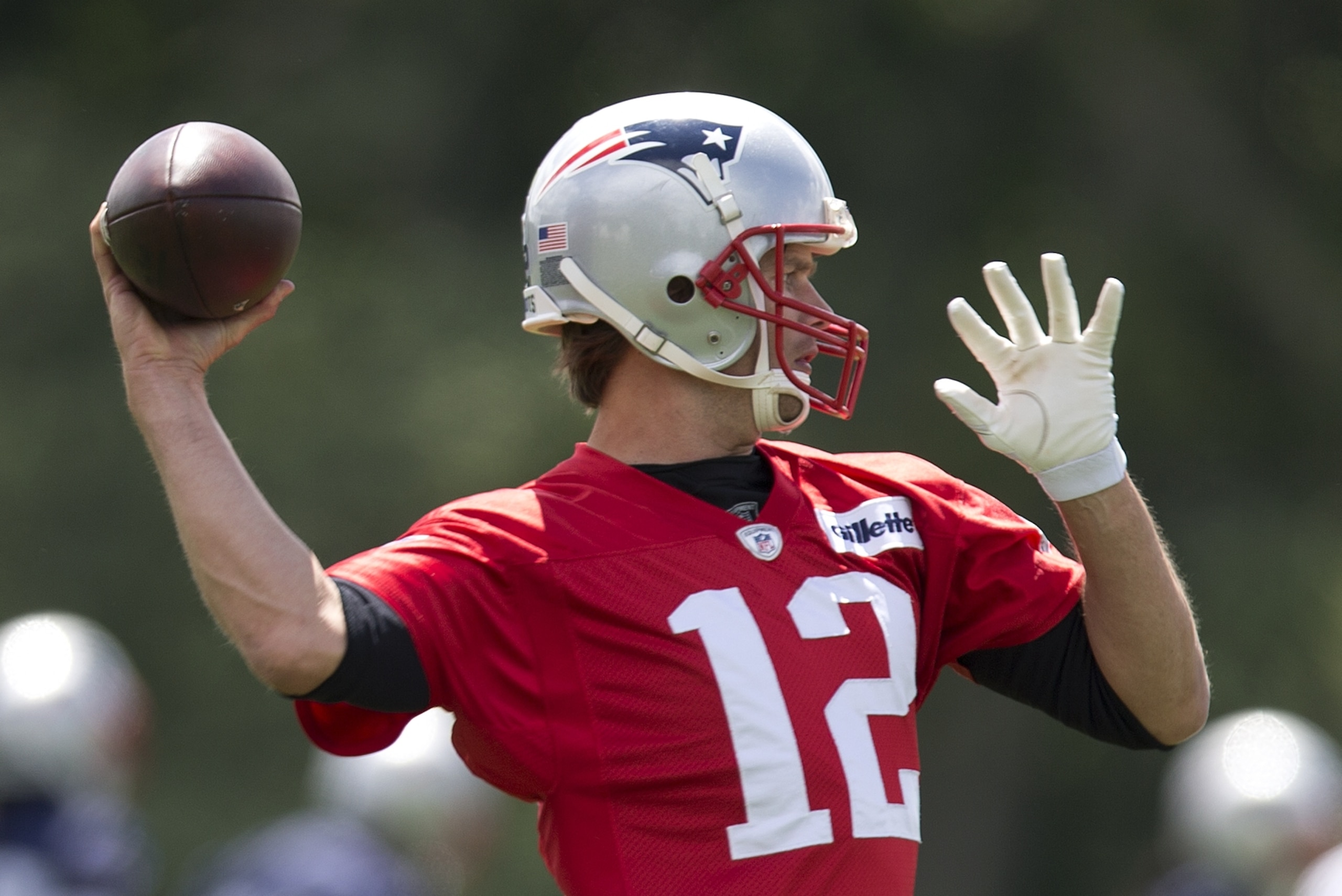 New England Patriots quarterback Tom Brady (12)  passes during an NFL football practice Monday, June 13, 2016, in Foxborough, Mass. (AP Photo/Michael Dwyer)
