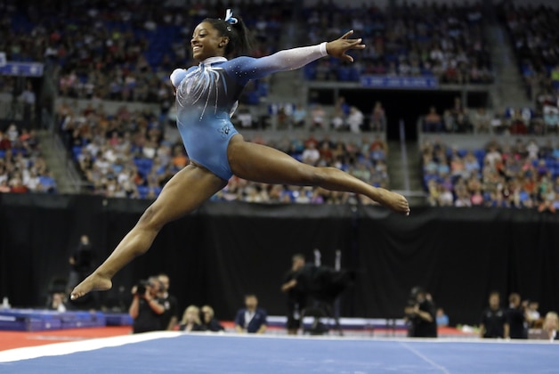 Simone Biles competes in the floor exercise during the U.S. women's gymnastics championships Sunday, June 26, 2016, in St. Louis. (AP Photo/Jeff Roberson)