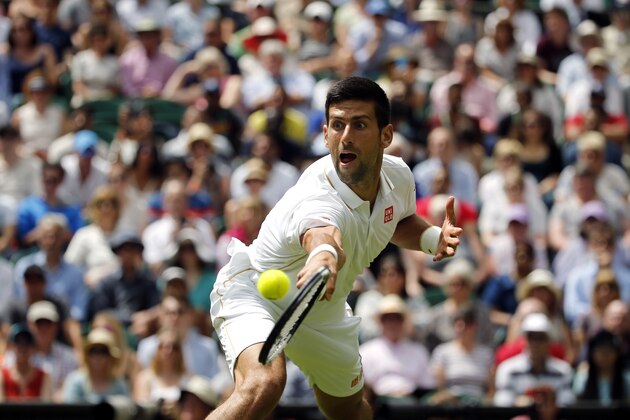 Novak Djokovic of Serbia plays a return to James Ward of Britain during their men's singles match on day one of the Wimbledon Tennis Championships in London, Monday, June 27, 2016. (AP Photo/Alastair Grant)