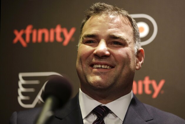 Former Philadelphia Flyers' Eric Lindros laughs while answering a question during a news conference before an NHL hockey game against the Minnesota Wild, Thursday, Nov. 20, 2014, in Philadelphia. Lindros and teammate John Leclair are being inducted into the Flyers Hall of Fame in a ceremony before the game. (AP Photo/Matt Slocum)