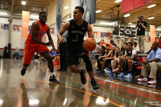 CHARLOTTESVILLE, VA - JUNE 19: Gary Trent Jr. #51 in white jogging back on defense during the NBPA Top 100 Camp on June 19, 2015 at John Paul Jones Arena in Charlottesville, Virginia. (Photo by Kelly Kline/Getty Images)