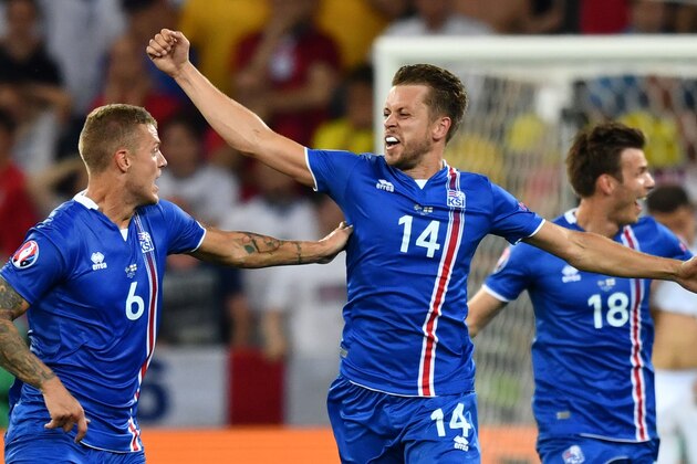 (LtoR) Iceland's defender Ragnar Sigurdsson and Iceland's defender Kari Arnason and Iceland's midfielder Theodor Bjarnason celebrate their team's win after the Euro 2016 round of 16 football match between England and Iceland at the Allianz Riviera stadium in Nice on June 27, 2016.  Iceland won the match 1-2. / AFP / BERTRAND LANGLOIS        (Photo credit should read BERTRAND LANGLOIS/AFP/Getty Images)