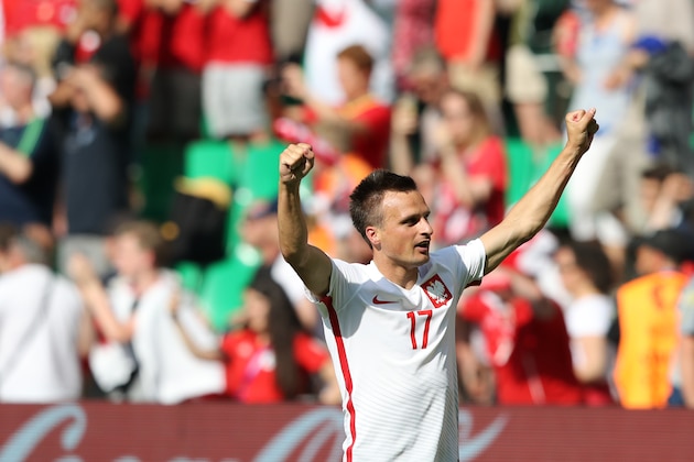 Poland's Slawomir Peszko celebrates at the end of the Euro 2016 round of 16 soccer match between Switzerland and Poland, at the Geoffroy Guichard stadium in Saint-Etienne, France, Saturday, June 25, 2016. Poland won 5-4 in a shootout. (AP Photo/Laurent Cipriani)