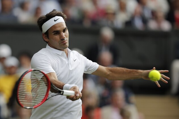 Switzerland's Roger Federer returns against Argentina's Guido Pella during their men's singles first round match on the first day of the 2016 Wimbledon Championships at The All England Lawn Tennis Club in Wimbledon, southwest London, on June 27, 2016. / AFP / ADRIAN DENNIS / RESTRICTED TO EDITORIAL USE        (Photo credit should read ADRIAN DENNIS/AFP/Getty Images)