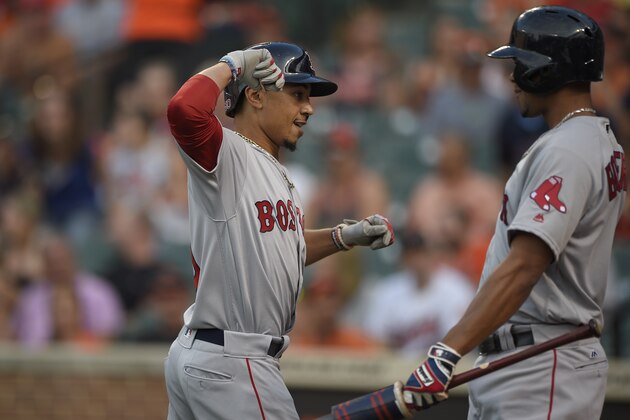 Boston Red Sox' Mookie Betts, left, celebrates his home run with Xander Bogaerts, right, during the first inning of a baseball game against the Baltimore Orioles, Tuesday, May 31, 2016, in Baltimore. (AP Photo/Nick Wass)