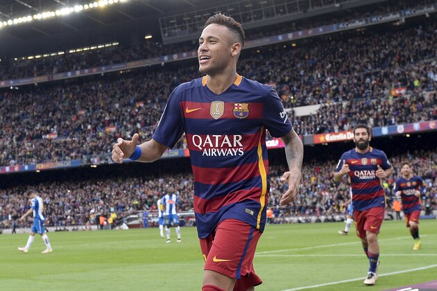 Barcelona's Brazilian forward Neymar (L) celebrates after scoring during the Spanish league football match FC Barcelona vs RCD Espanyol at the Camp Nou stadium in Barcelona on May 8, 2016.   / AFP / JOSEP LAGO        (Photo credit should read JOSEP LAGO/AFP/Getty Images)