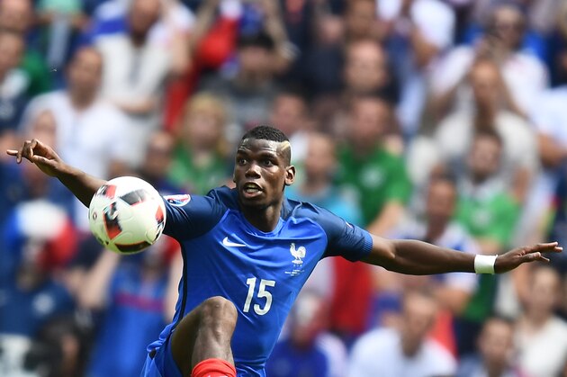 France's midfielder Paul Pogba plays the ball during the Euro 2016 round of 16 football match between France and Republic of Ireland at the Parc Olympique Lyonnais stadium in Décines-Charpieu, near Lyon, on June 26, 2016. / AFP / FRANCK FIFE        (Photo credit should read FRANCK FIFE/AFP/Getty Images)