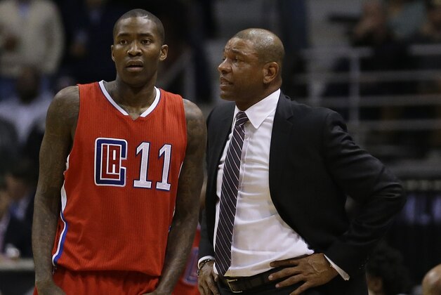 Los Angeles Clippers head coach Doc Rivers talks with Los Angeles Clippers' Jamal Crawford during an NBA basketball game against the Milwaukee Bucks Wednesday, Dec. 9, 2015, in Milwaukee. (AP Photo/Aaron Gash)