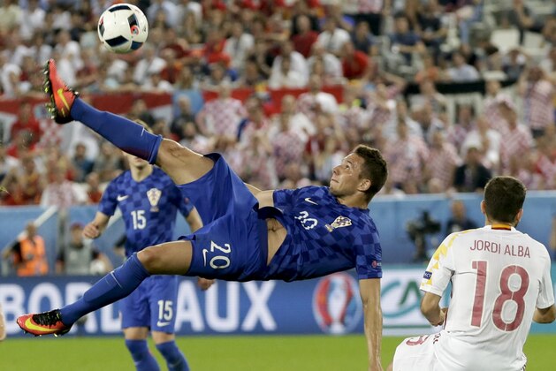 Croatia's Marko Pjaca goes for an overhead kick during the Euro 2016 Group D soccer match between Croatia and Spain at the Nouveau Stade in Bordeaux, France, Tuesday, June 21, 2016. (AP Photo/Petr David Josek)