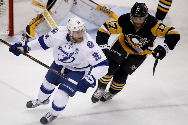 Tampa Bay Lightning's Steven Stamkos skates beside Pittsburgh Penguins' Bryan Rust (17) during the first period of Game 7 of the NHL hockey Stanley Cup Eastern Conference finals, Thursday, May 26, 2016, in Pittsburgh. (AP Photo/Gene J. Puskar)