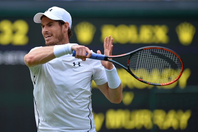 Britain's Andy Murray returns against Britain's Liam Broady during their men's singles first round match on the second day of the 2016 Wimbledon Championships at The All England Lawn Tennis Club in Wimbledon, southwest London, on June 28, 2016. / AFP / GLYN KIRK / RESTRICTED TO EDITORIAL USE        (Photo credit should read GLYN KIRK/AFP/Getty Images)