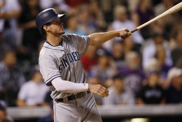 San Diego Padres' Wil Myers watches his three-run home run off Colorado Rockies reliever Jake McGee during the ninth inning of a baseball game Friday, June 10, 2016, in Denver. San Diego won 7-5. (AP Photo/David Zalubowski)