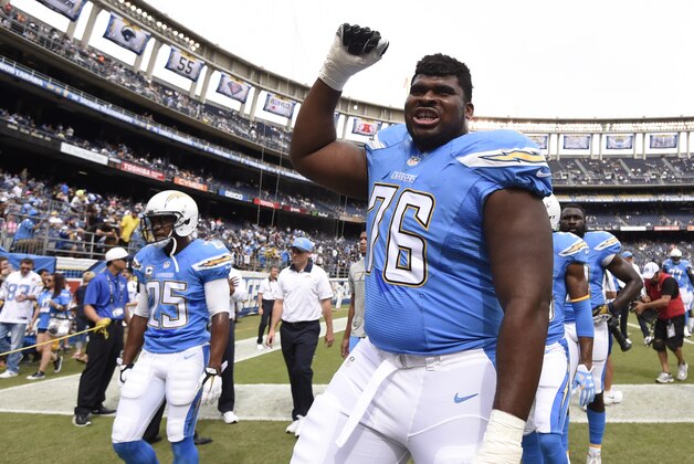 San Diego Chargers offensive guard D.J. Fluker (76) reacts to fans before an NFL football game against the Oakland Raiders Sunday, Oct. 25, 2015, in San Diego. (AP Photo/Denis Poroy)